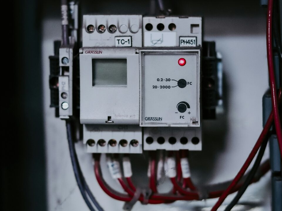 Close-up of an industrial PLC and terminal wiring inside a control panel